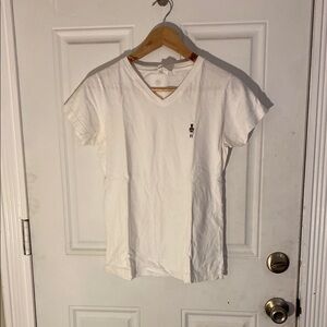 White V-Neck Tee with Embroidered Figure